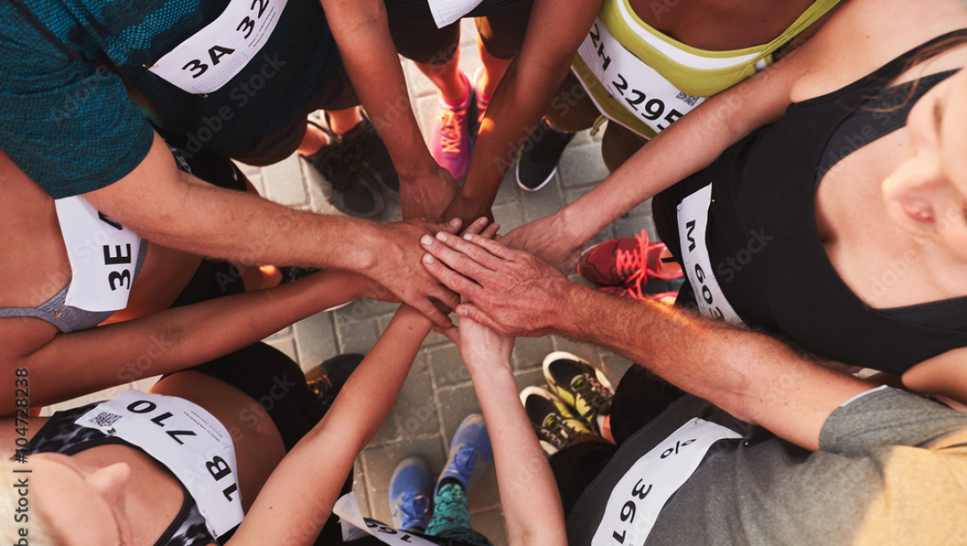Athletes put their hands together before a big race.