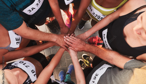 Athletes put their hands together before a big race.